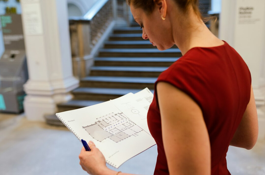investor reviewing property plans