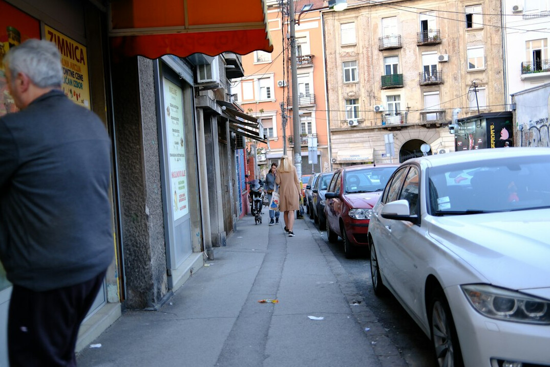 person walking in shopping street